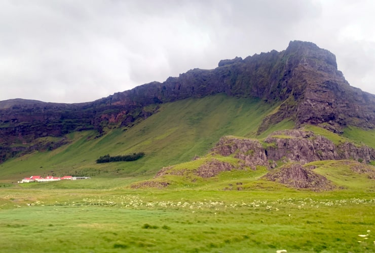 View of Home at Base of mountain 8 day Iceland Ring Road Tour