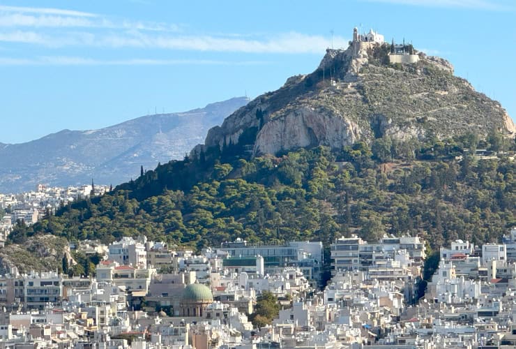 View of Lycabettus Hill from the Greek Flag of Athens platform on the Acropolis of Athens