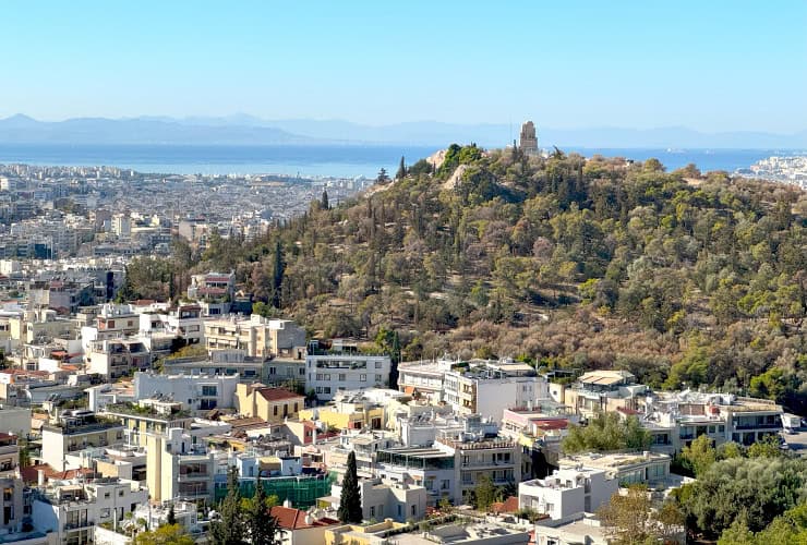 View of the Philopappos Monument resting atop Mouseion Hill from the Acropolis of Athens